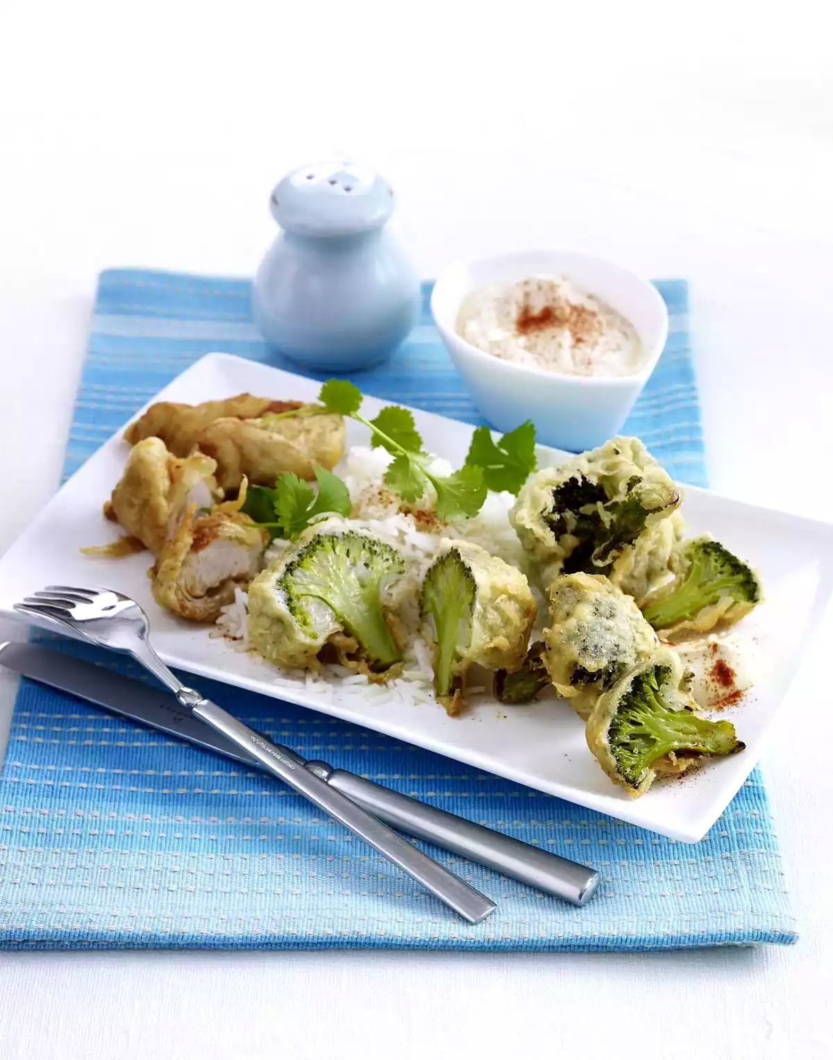 Fried broccoli florets and chicken nuggets with yoghurt dip and basmati rice