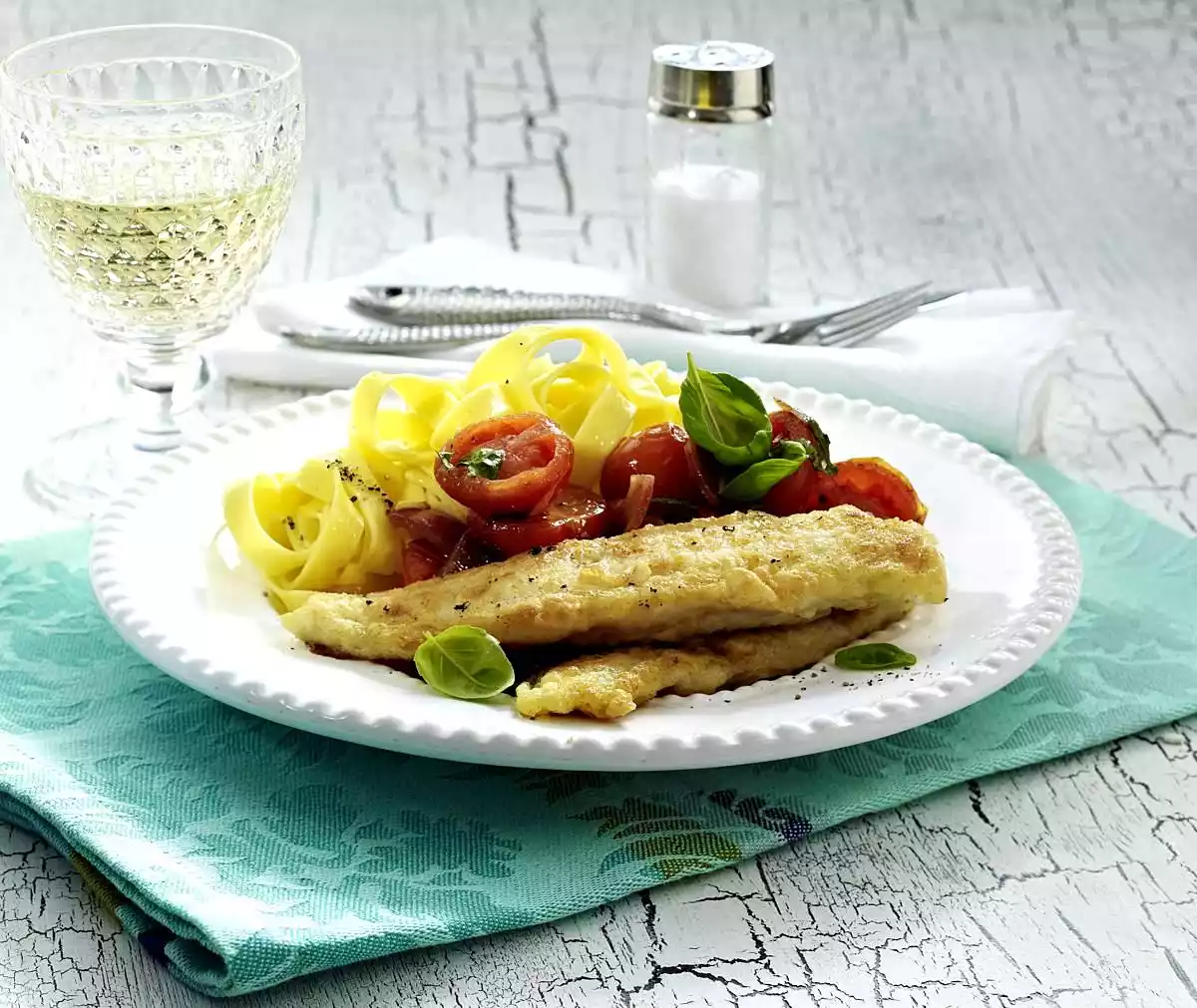 Pangasius fillet with braised cherry tomatoes and ribbon noodles