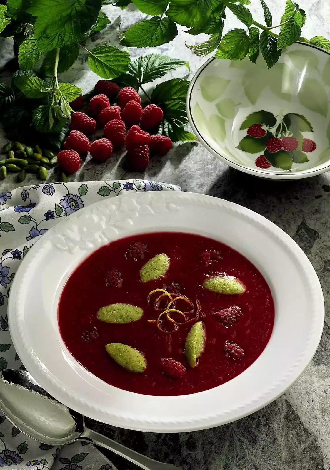 Raspberry cold dish with pistachio semolina dumplings